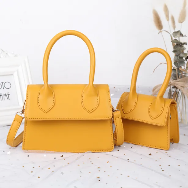 Small bag female new fashion slung simple scrub small concave shape yellow bag mini bag handbag