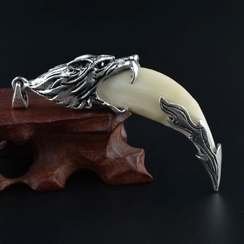 Wolf tooth pendant really black dog tooth