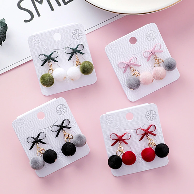 Korean version of the sweet bow velvet small hair ball earrings female temperament hair ball earrings plush autumn and winter new earrings