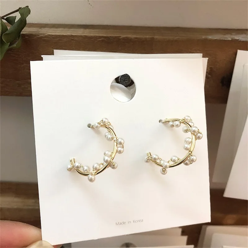 Pearl garland winding semicircular earrings