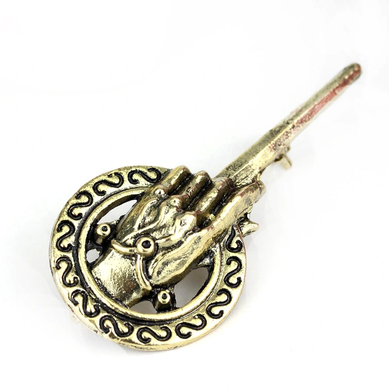 King's hand brooch