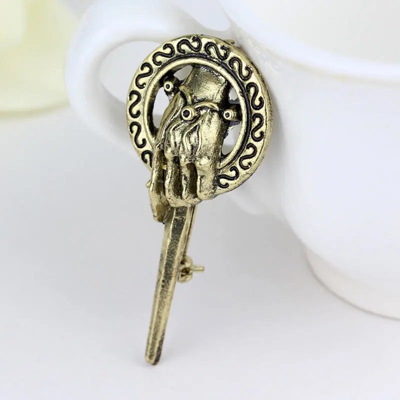 King's hand brooch
