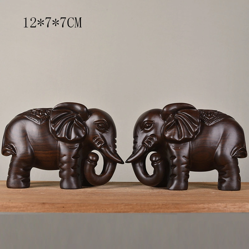 A Pair Of Wooden Home Carved Elephant Ornaments