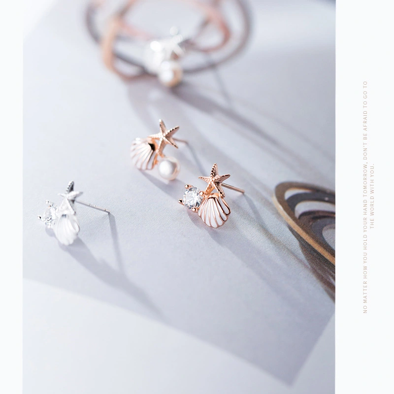 A starfish shell studded with diamond earrings