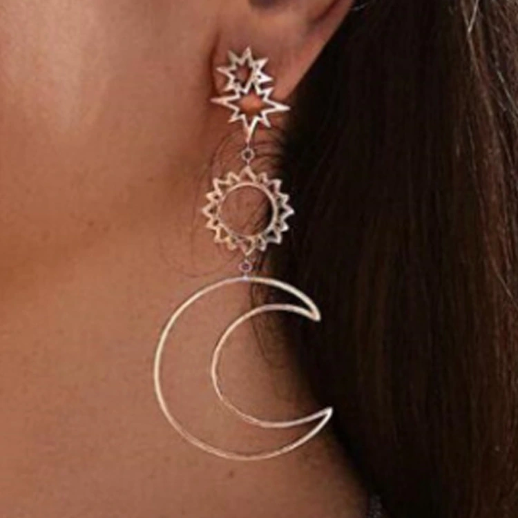 Asymmetric exaggerated moon sun earrings