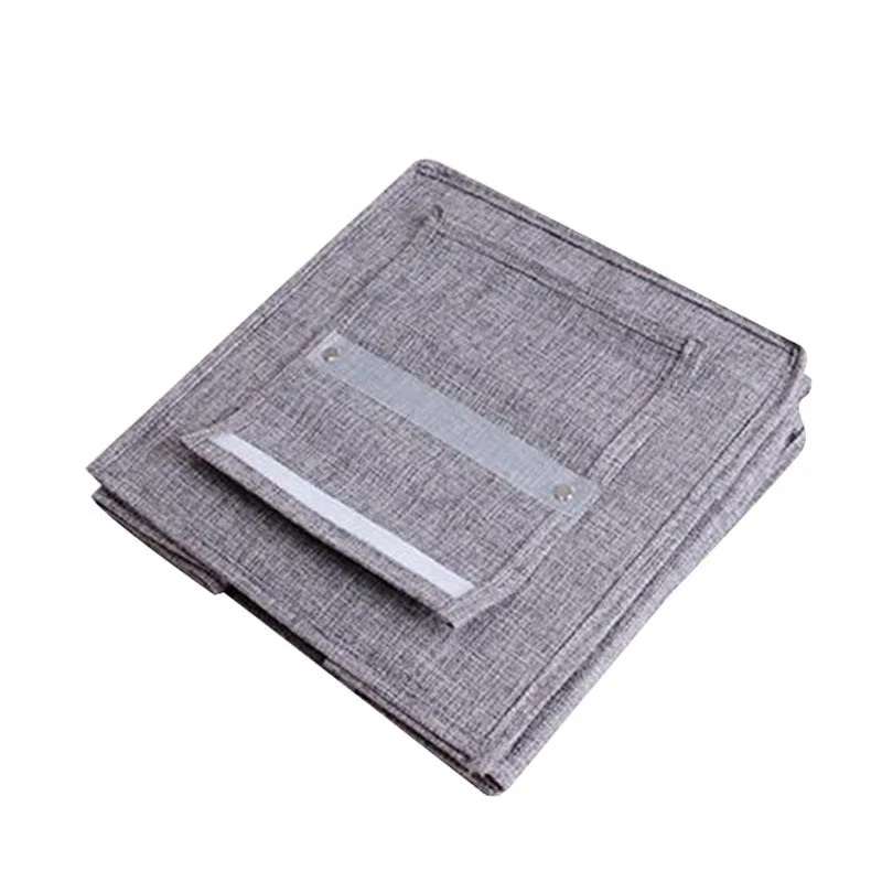 The linen cabinet contains hanging bags