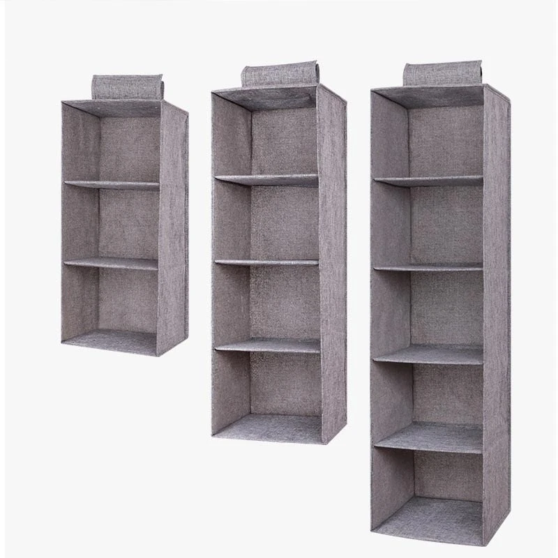 The linen cabinet contains hanging bags