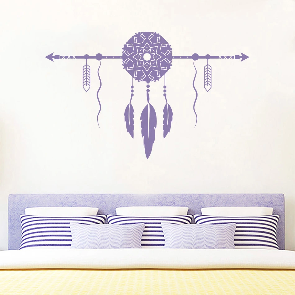 Dream catcher arrowhead wall stickers adorn the girls' room