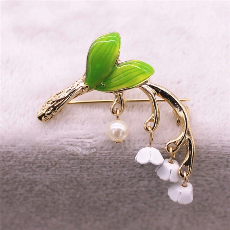 Green drip-glazed lily of the valley brooch