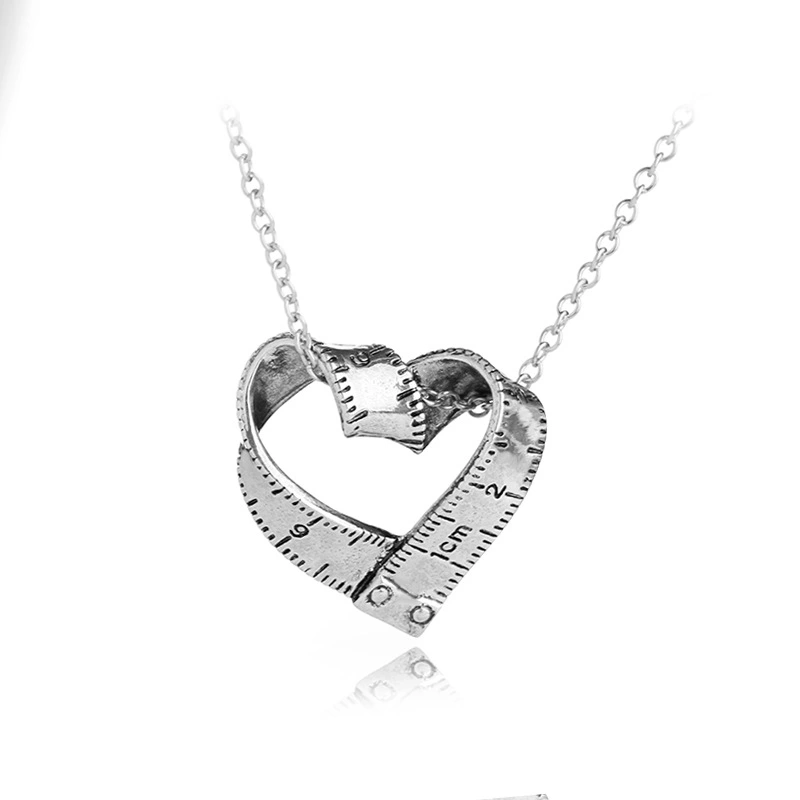 Heart-shaped rotating tape measure necklace