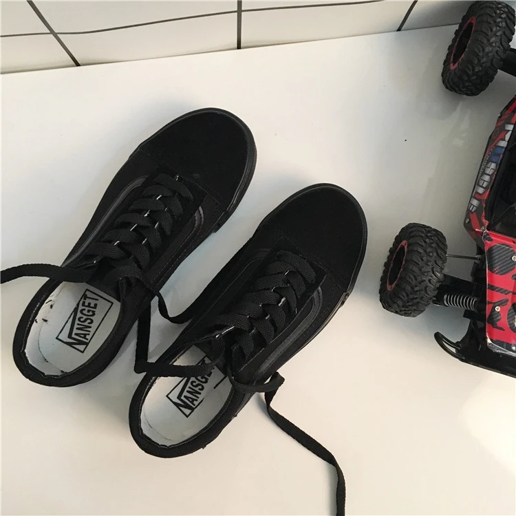All black canvas shoes tide