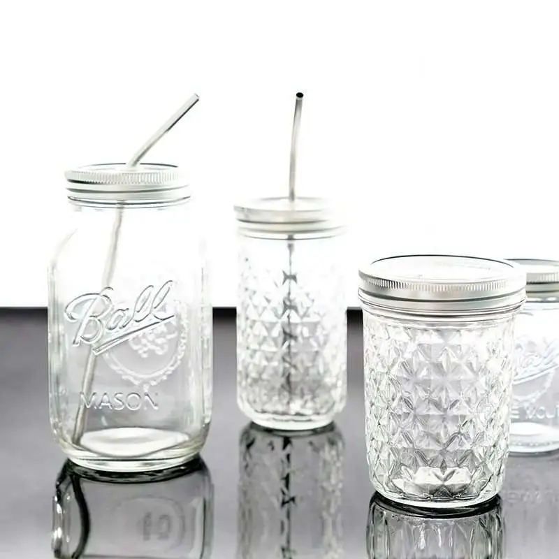 Mason bottle with a mason glass juice drink straw water glas