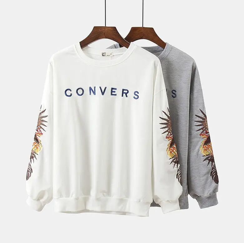 Loose fitting short embroidered sweater