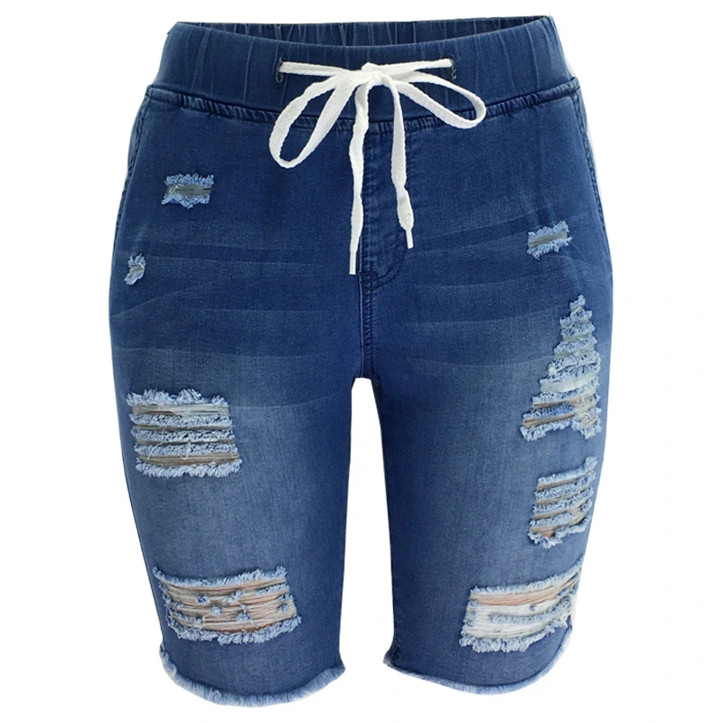 Medium-Washed Blue Jeans With Holes In The Pants