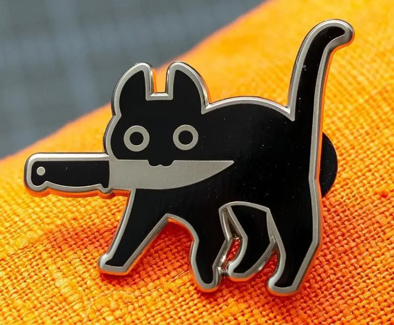 Cowboy Badge Black Kitten Holding A Knife Badge