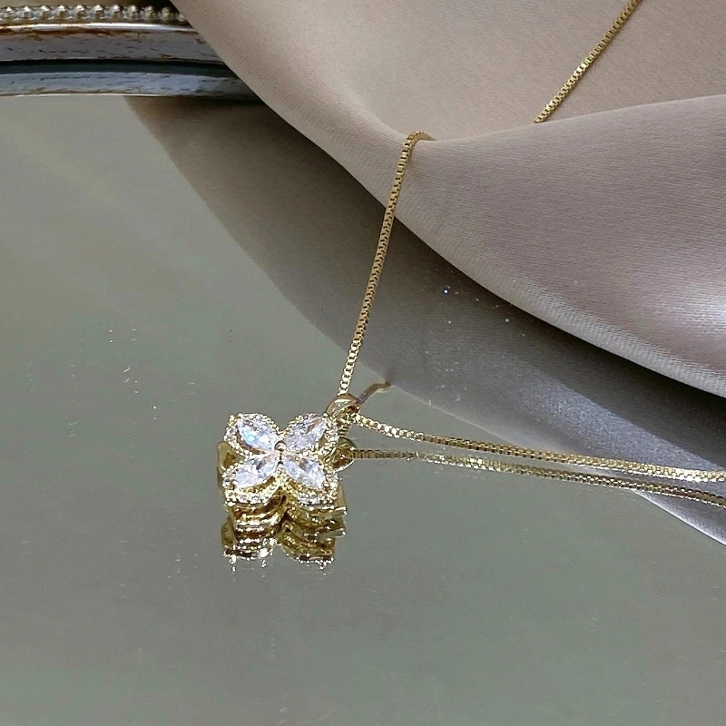 Rotating Four Petal Flower Pendant Necklace