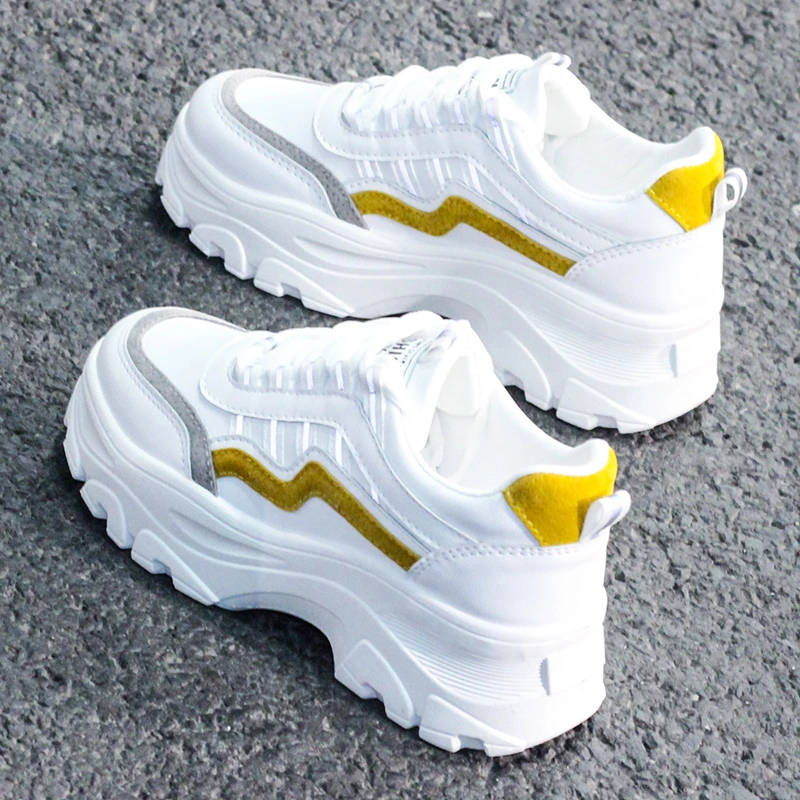 Small white shoes with thick soles