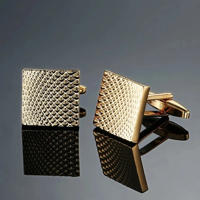 Copper cufflinks with square carved patterns