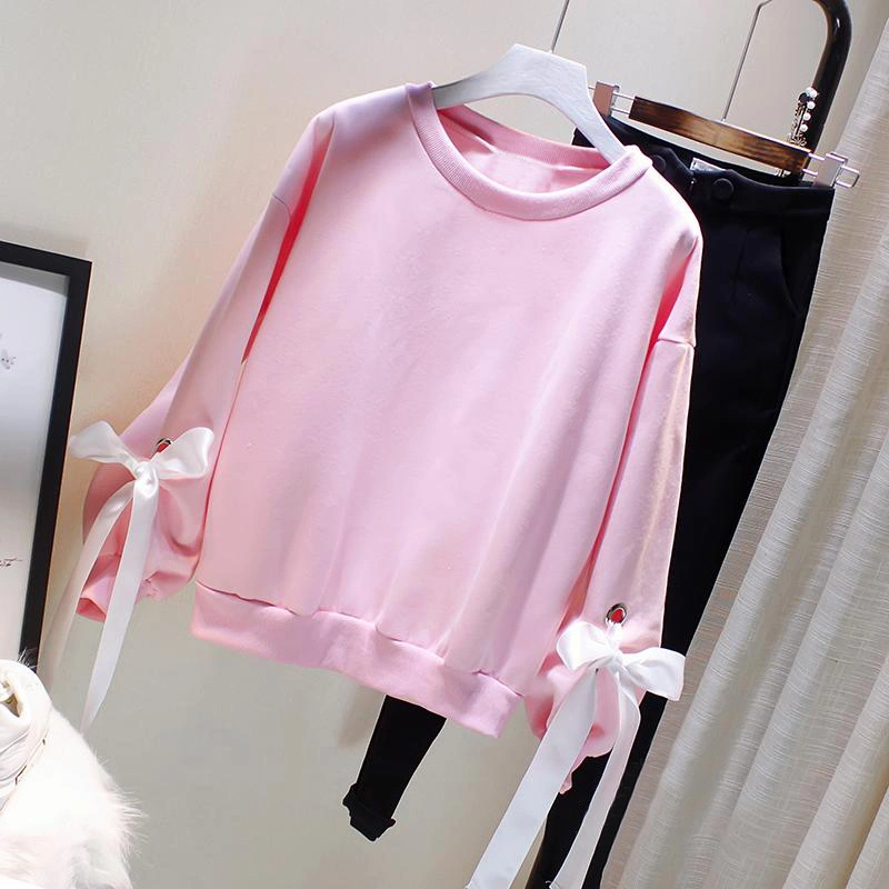 Women's solid sweater with bow