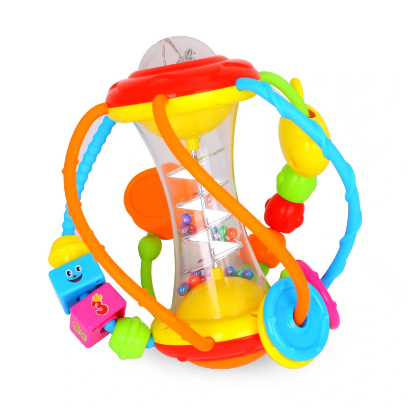 Baby hand holding rattle ball toy