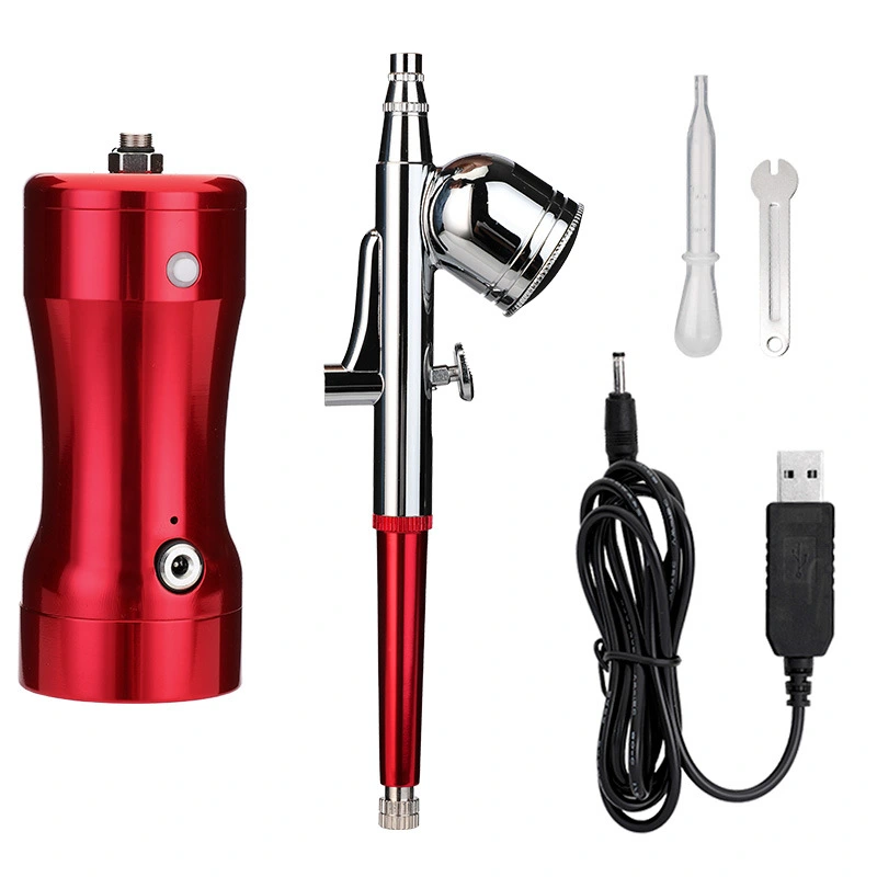 Manicure. Beauty. Cake coloring. Hand-held air pump charging portable airbrush