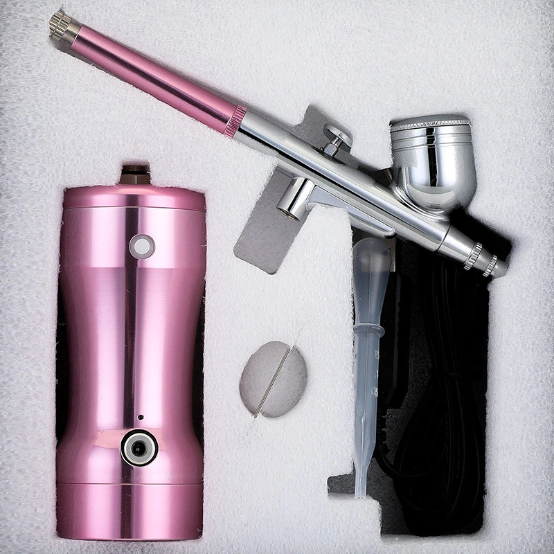 Manicure. Beauty. Cake coloring. Hand-held air pump charging portable airbrush