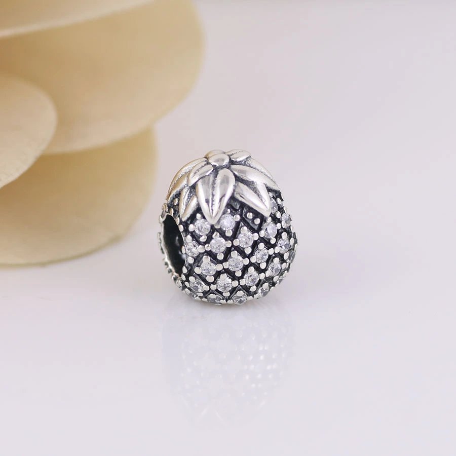 Pineapple and pineapple beads inlaid with stone