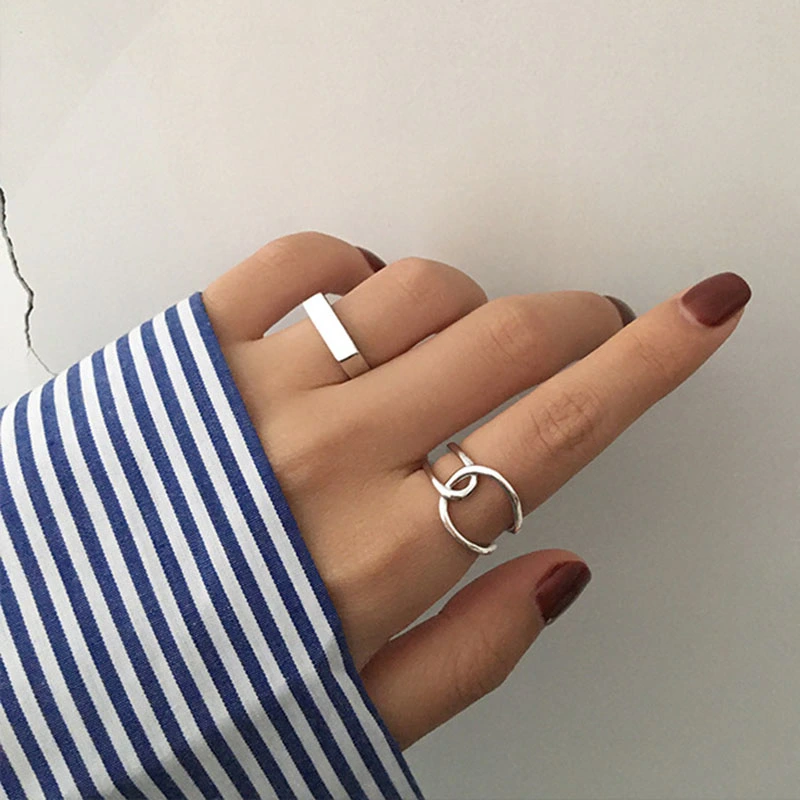 Geometric cross opening index finger ring