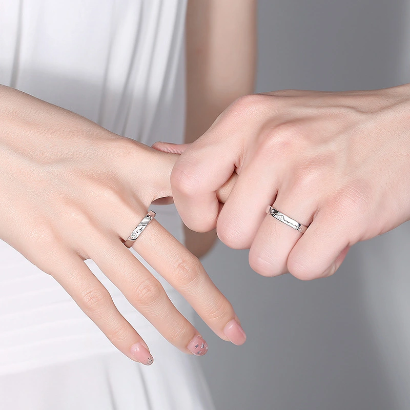 A Pair Of Sterling Silver Couple Rings