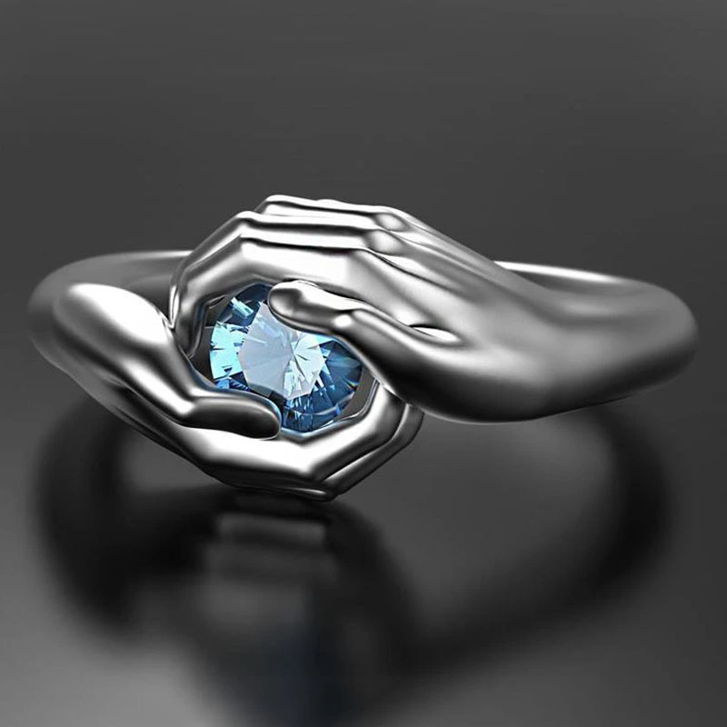 Fashionable Hands Hugging Sapphire Ring