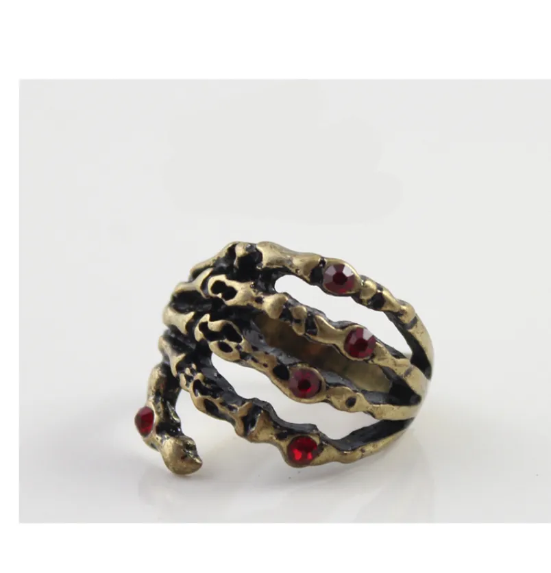 Fashion Retro Gold Punk Skeleton Hand Red Flash Diamond Ring