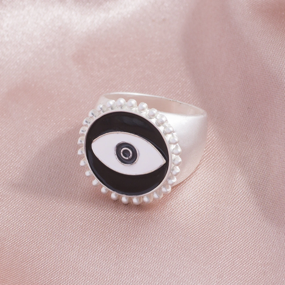 Matte gold and silver exaggerated dripping eye ring