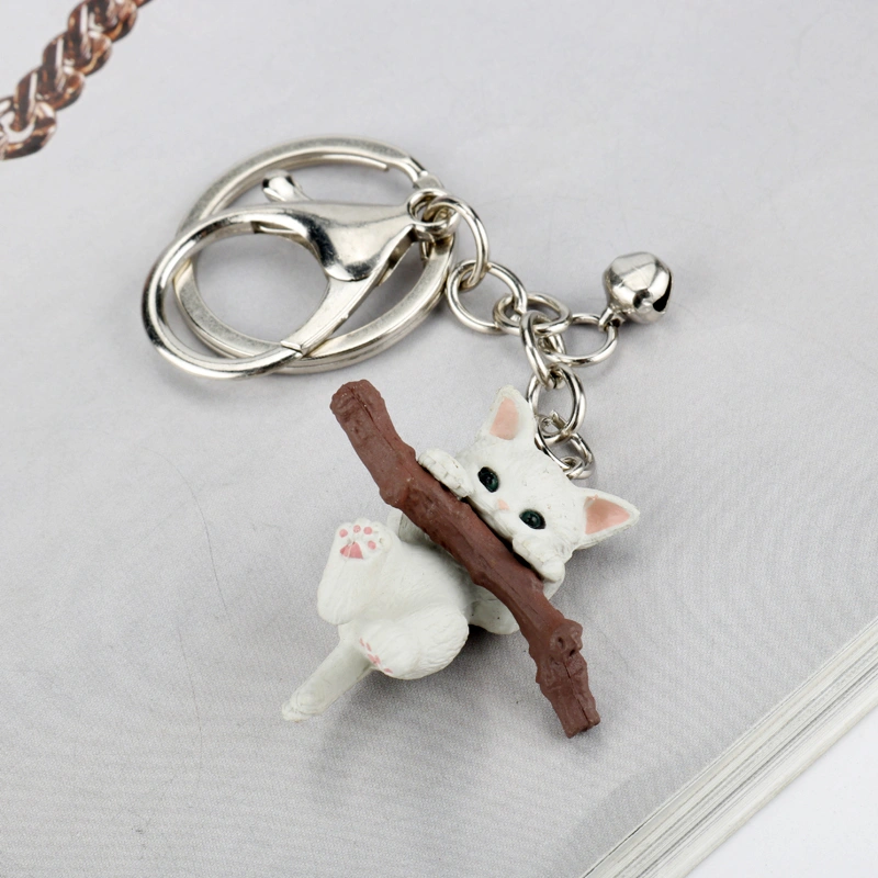 Keychain for holding tree branch cat doll