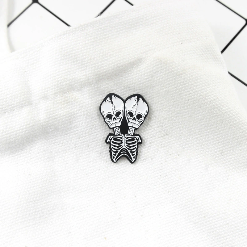 Conjoined skull Brooch