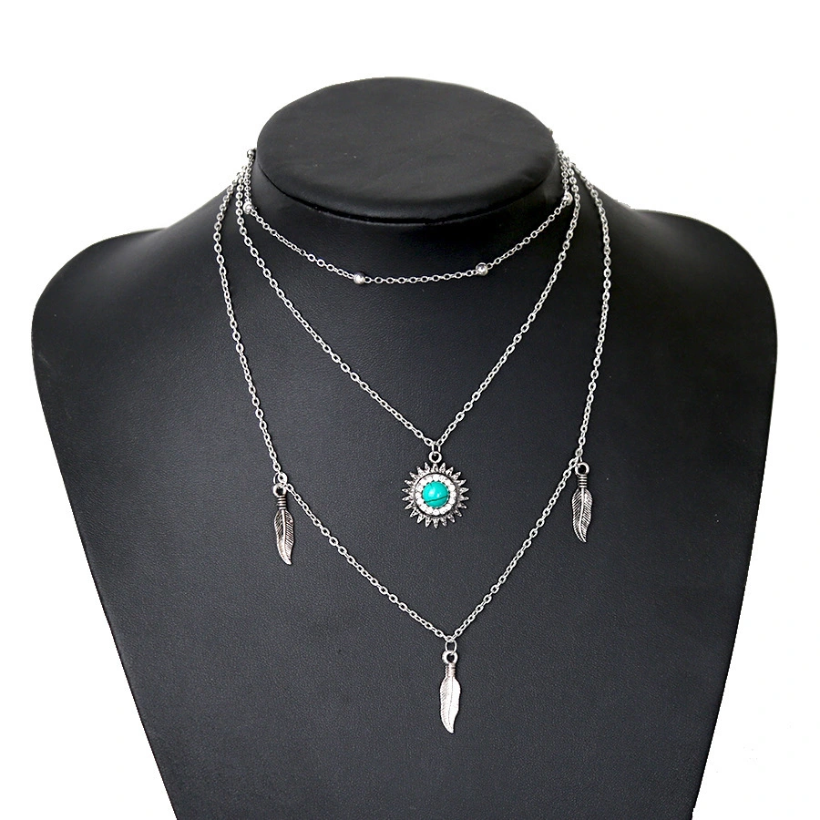 Multi layer necklace with metal feathers