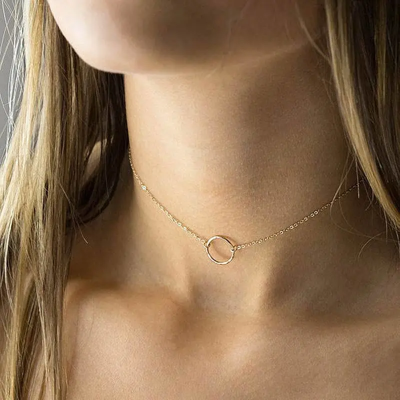 Delicate brass ring necklace