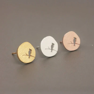 Birds stand in the branches hollowed out bird ear studs