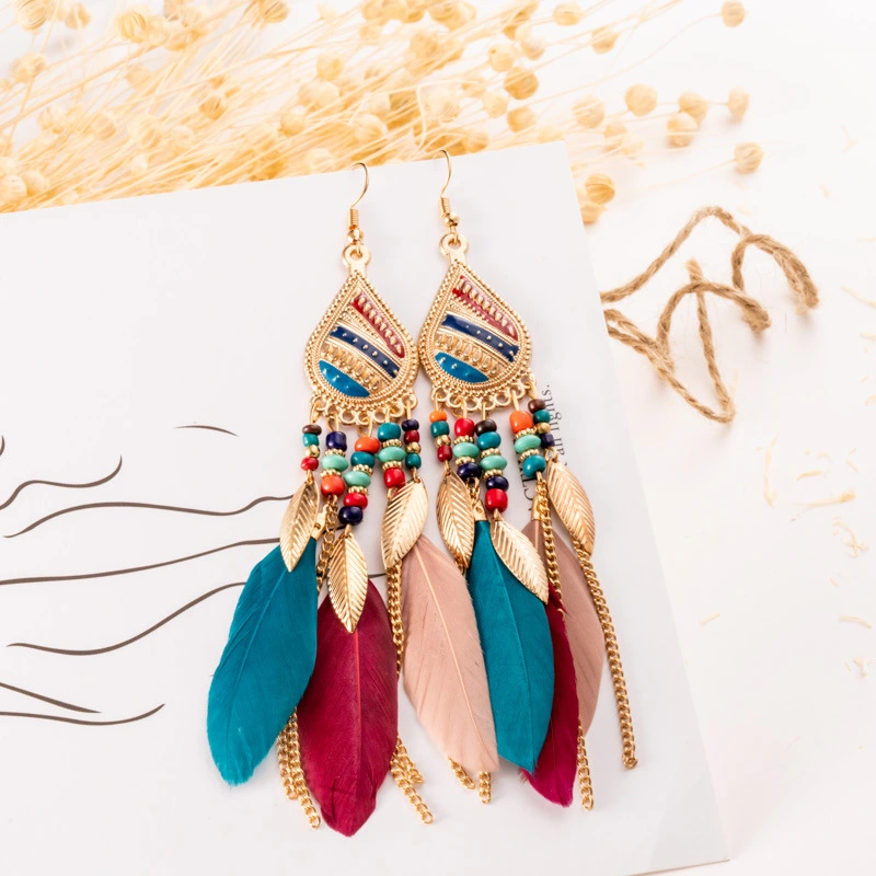 Feather earrings and pearl earrings