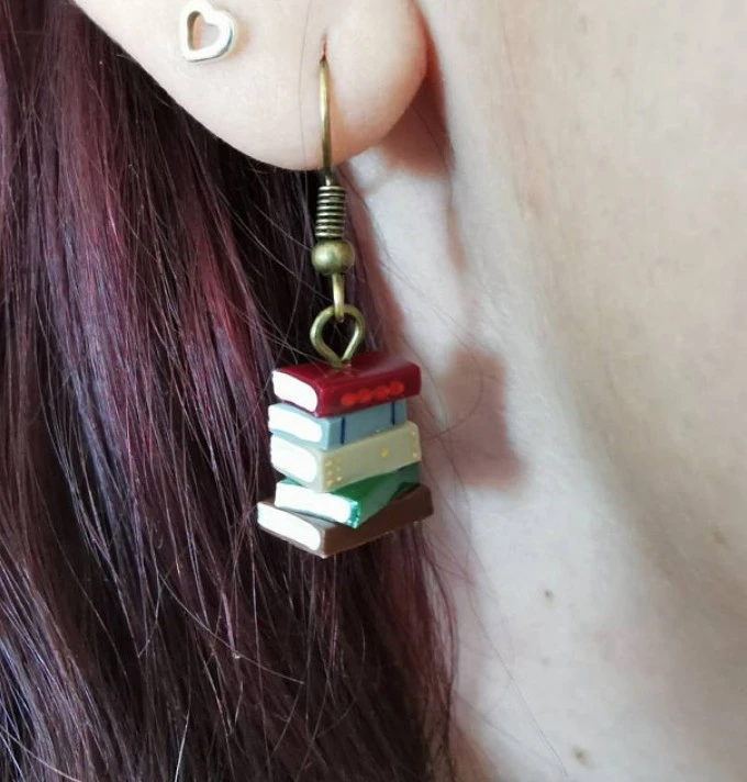 A Pile Of Book Earrings In The Retro Library