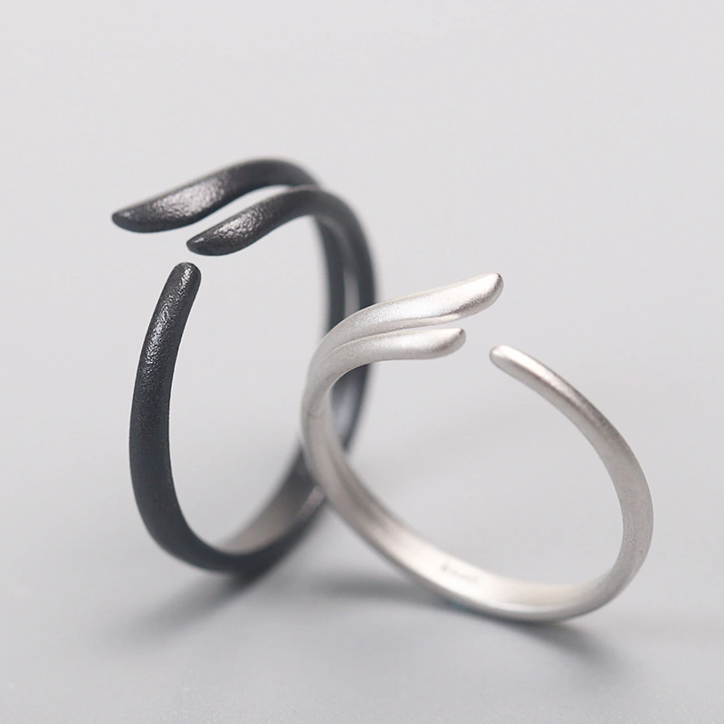 Simple Black And White Wings Couple's Ring