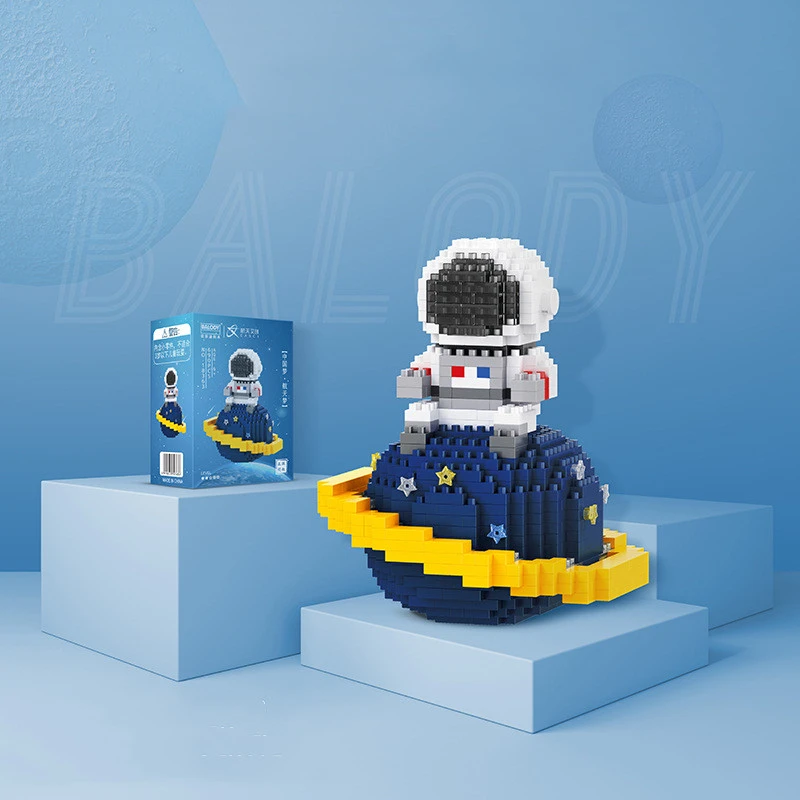 Astronaut Modeling Tiny Building Blocks Particles Assembled Toys