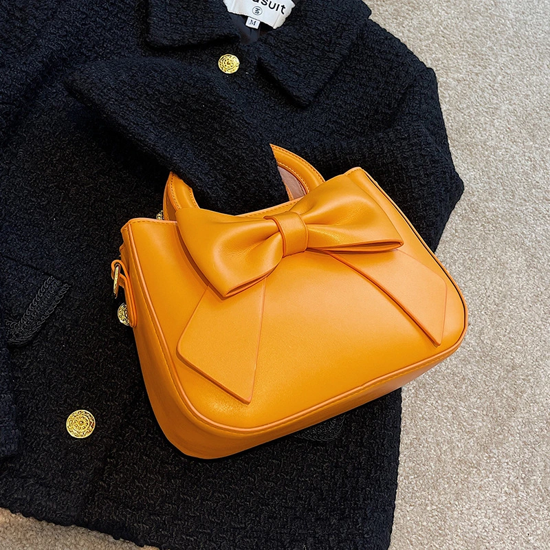 Small Square Bag With Bow On Hand