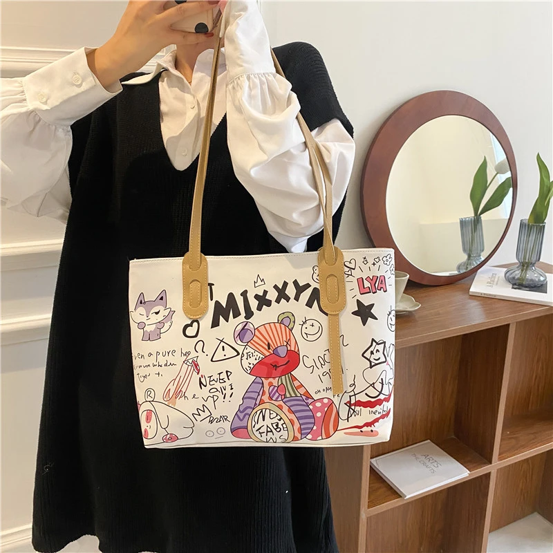 Japanese literary handbag 2022 new trendy fashion graffiti printing net red popular portable shoulder armpit tote bag