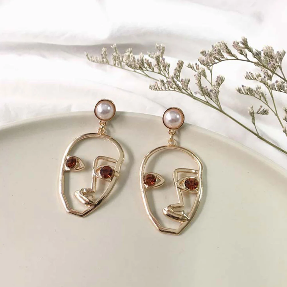 1 Pair of Earrings Hollow Artistic Temperament Abstract Human Face Female Earrings (Orange Eyes)