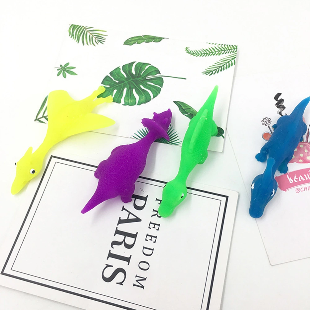 12pcs Finger Toys Slingshot Flying Toy Simulation Dinosaur Rubber Band Stretchy Toys Finger Plaything (Random Color)