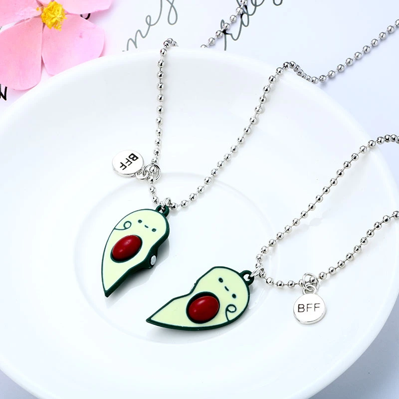 A Pair Of Avocado Necklaces Attract Magnets