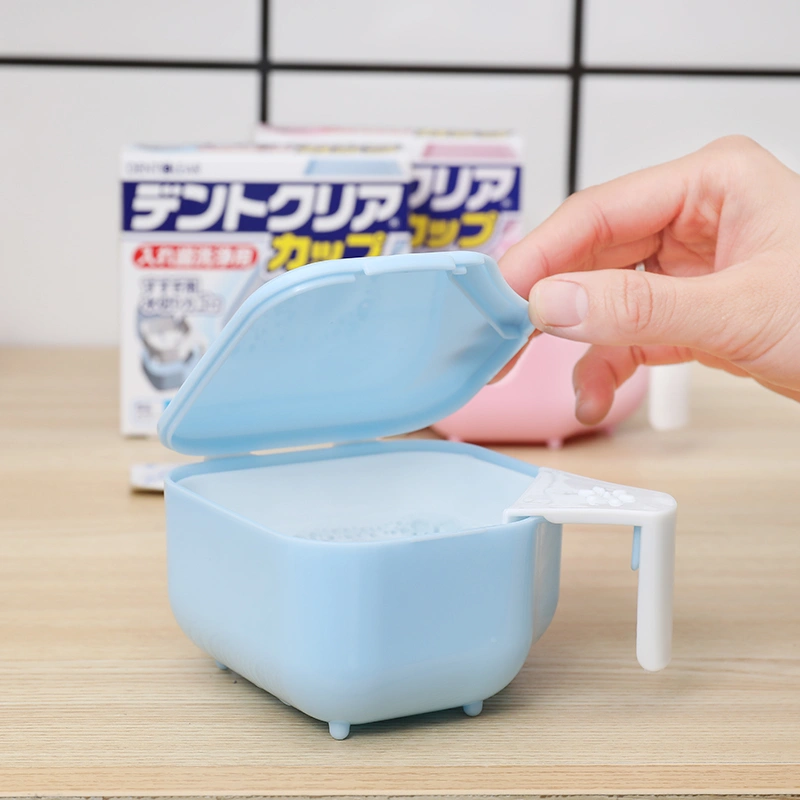 The Elderly Put The Denture Cup And Carry The Tooth Storage Box