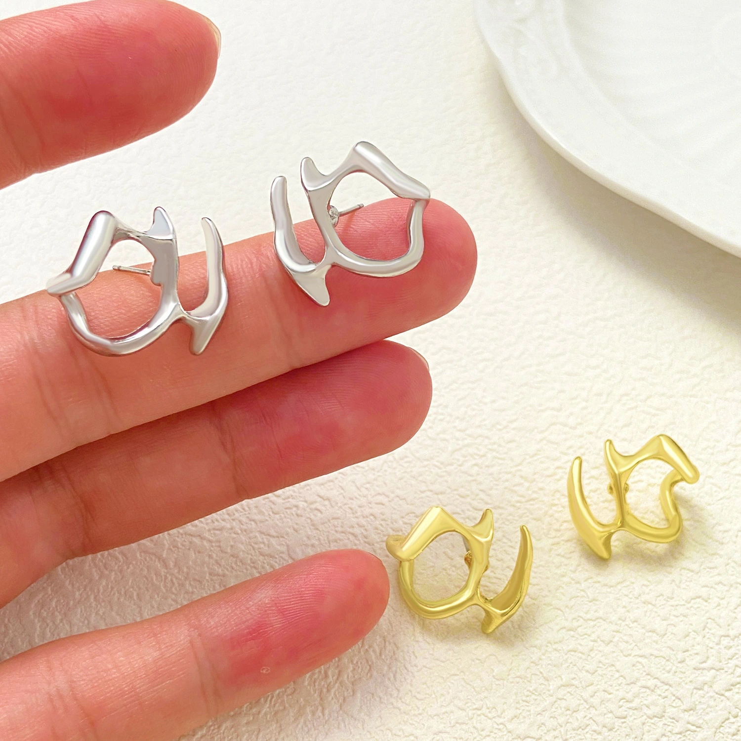 Cold Wind Irregular Liquid Hollow Ear Stud