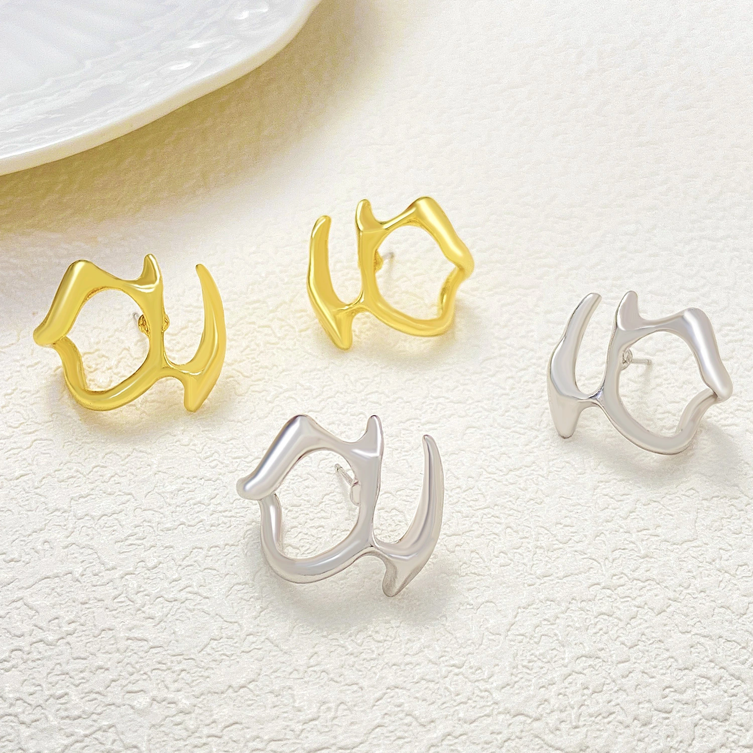 Cold Wind Irregular Liquid Hollow Ear Stud