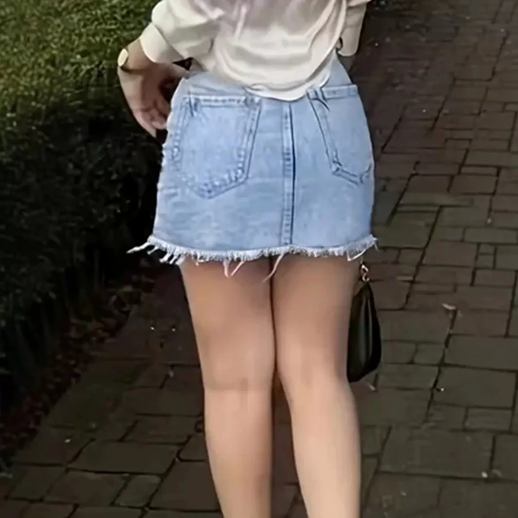 Ripped Denim Mini With Raw Hem Street-style Casual Denim Skirt Featuring Pockets